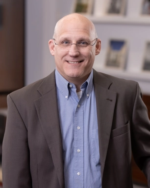 portrait of a smiling person in professional attire